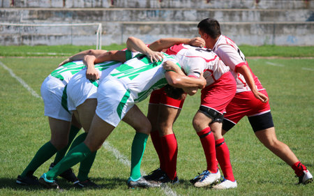 rugby players pushing in a scrum sportの写真素材