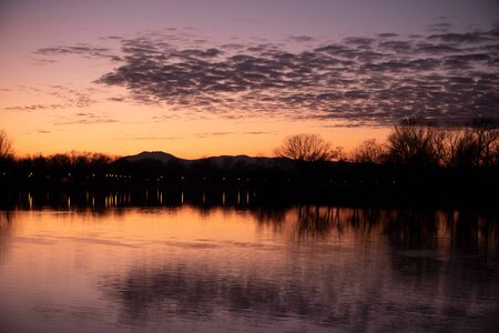 Sunset over lake in mountainsのeditorial素材