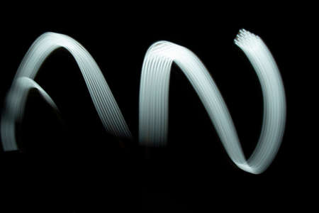 Led light painting .White Color Light Painting Photography Over Black Backgroundの写真素材