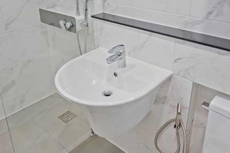 Moderately priced bathroom sinks used in householdsの写真素材