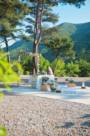 Outdoor wedding hall deep in the mountains with colorful flowersの写真素材