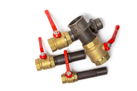 Ball valves connected to a pipes on white background