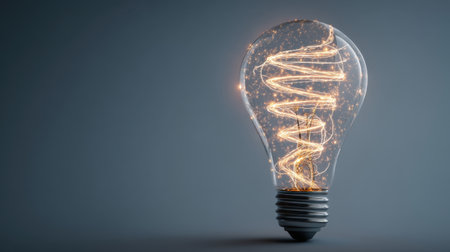 A stunning light bulb glows with a swirling filament, creating a captivating visual effect. The modern design illuminates a dark space, adding a touch of warmth and creativity.の素材