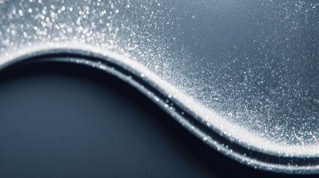 This image features a mesmerizing blue wave texture with sparkling glitter, creating an elegant and artistic background perfect for design projects.の素材