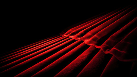 Captivating image of elegant red drapery showcasing soft folds and rich texture against a dark background, perfect for enhancing interior design projects or artistic themes.の素材