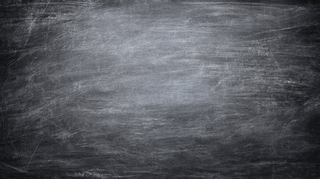 A textured blackboard surface features scratches and smudges, creating a rustic background ideal for various educational and creative projects. Perfect for presentations.の素材