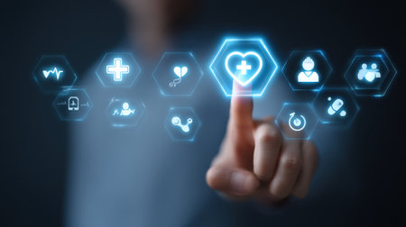 A close-up view of a finger interacting with a virtual touchscreen displaying glowing health and medical icons, symbolizing innovation in healthcare technology and patient care.の素材