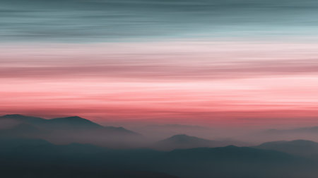 A stunning view of a gradient sky at dusk, showcasing soft hues over misty mountains. The serene atmosphere evokes peace and tranquility in nature.の素材