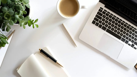 A serene workspace featuring a laptop, cup of coffee, open notebook, and a green plant. This setup promotes creativity and productivity in a minimalistic design.の素材