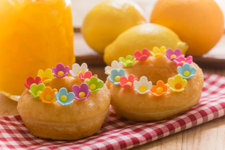 Close up of tasty donuts on wooden table