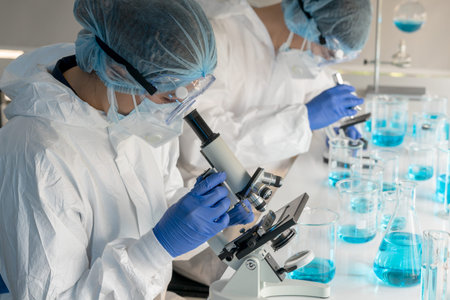 Female scientists use microscopes to research