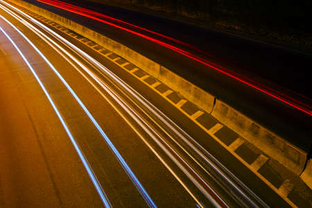 Movement at speed along the highway at nightの写真素材