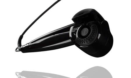 Curling iron for black hair isolated on whiteの写真素材