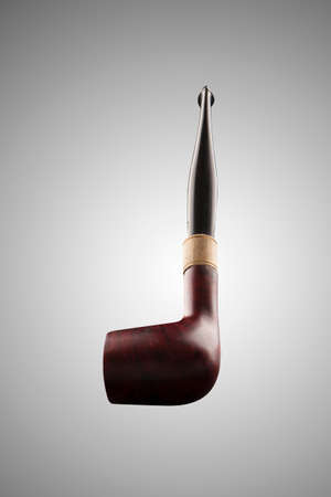 Wood smoking pipe with golden ringの写真素材