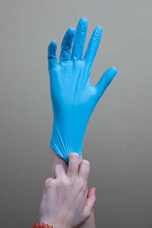 Blue medical nitrile plastic gloves texturedの写真素材