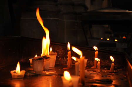 burning candles in the catholic churchの写真素材