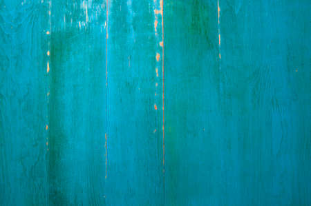 Wooden background painted with weathered green paintの写真素材