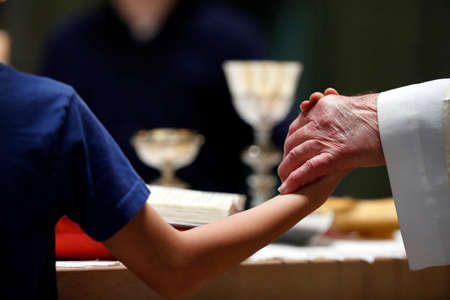 The Visitation Monastery. Catholic mass. Eucharist celebration. The Lord's Prayer also called the Our Father. Marclaz. France. 03/22/2018のeditorial素材