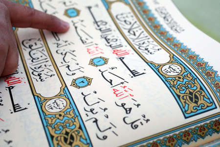 Imam reading the Quran in a mosque.の写真素材