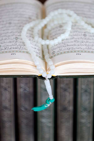 Putra Mosque or Masjid Putra. Open Quran with islamic prayer beads (misbaha). Putrajaya. Malaysia.の写真素材