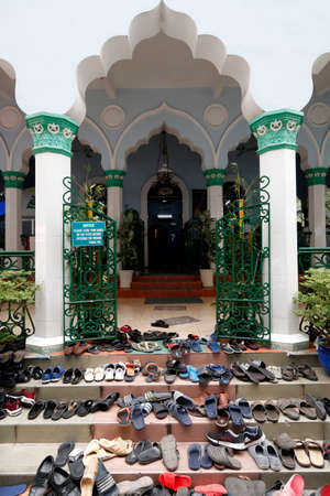 Cholon Jamail Mosque. The friday prayer (jummah). Shoes outside the mosque. Ho Chi Minh City. Vietnam.のeditorial素材