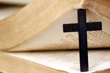 Christian cross and old Bible. 18 th century. France.の写真素材