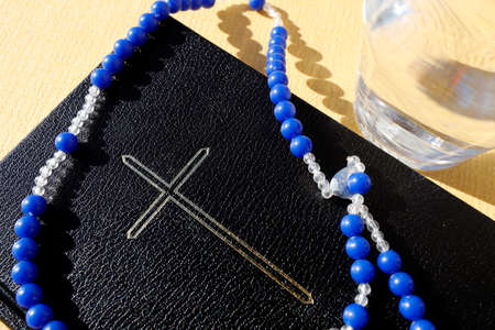 Slow starts on Ash Wednesday and finishes on Holy Thursday Evening. Fasting and abstinence. Bible, Rosary and water. Italy.の写真素材
