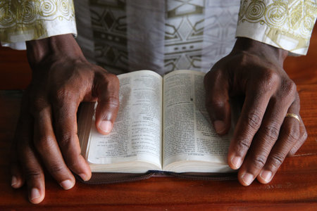 African man reading the bible. Close-up. Lome. Togo.