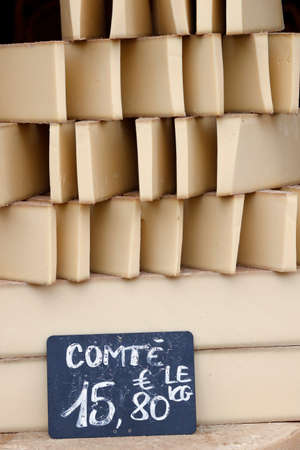 Traditional french cheese for sale at market. County. France.の写真素材