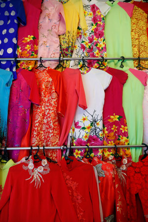 Colorful Vietnamese traditional long dress Ao Dai for sale in a shop. Ho Chi Minh City. Vietnam.
