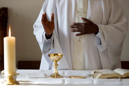 Coronavirus epidemic (covod-19). Celebration of Sunday Mass in a chapel of Saint Joseph des Fins Basilica. Eucharist celebration. Annecy. France.の写真素材