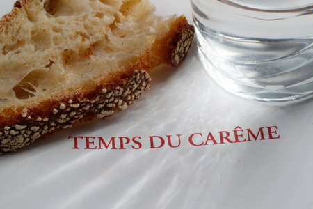 Slow starts on Ash Wednesday and ends on Holy Thursday Evening. Glass of water and bread.