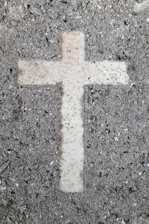 Cross made of ashes. Ash Wednesday. Slow season. France.