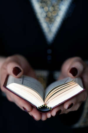 Muslim woman reading the noble Quran. United Arab Emiratesの写真素材