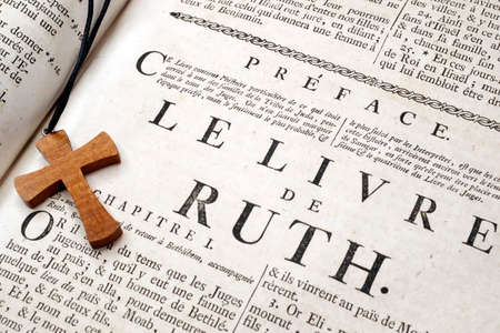 Old Bible in french. 18 th century. Old Testament. The Book of Ruth. Christian cross. France.のeditorial素材
