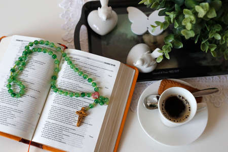 Open holy bible and cup of coffee. Religion at home. Faith and spirituality.の写真素材