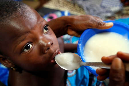 African hospital. Pediatric unit. Meal. Benign.の写真素材