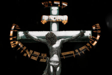 Statue of Jesus on the cross with Hebrew lettering on Charles bridge. Czech Republic.の写真素材