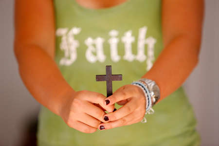 Young christian with a cross. France.の写真素材