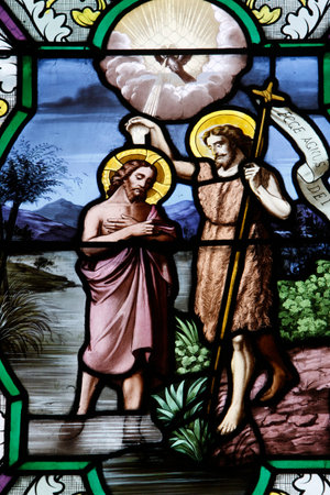 Stained glass window: Jesus's baptism. France.