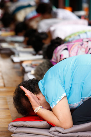 Woman at morning ceremony. Jogyesa Buddhist Temple. South Korea.の写真素材