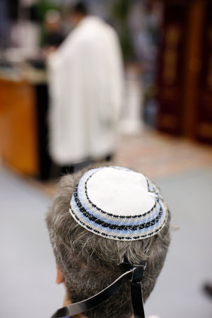 Man wearing a yarmulke in a synagogue. France.の写真素材