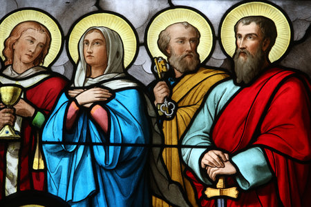 Holy Sacrament church. Stained glass window. St Peter, St Paul and Virgin Mary. France.
