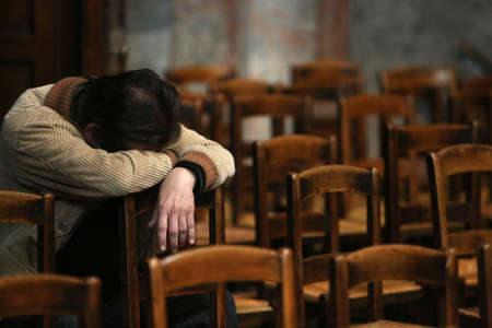 Saint-Sulpice church. Man praying. France.のeditorial素材
