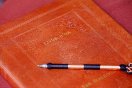 Guestbook and pen on the table. Marrakesh. Morocco.