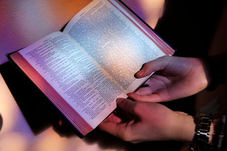 Young girl reading the Bible. Faith and religion. France.
