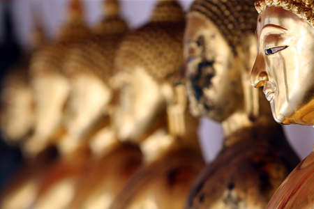 Seated Golden Buddha statues in a row at Wat Pho (Temple Of The Reclining Buddha), Bangkok. Thailand.のeditorial素材
