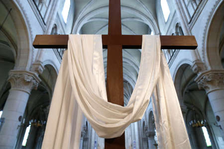 Saint Ambrose church. Holy week. The cross and the white cloth symbolize the resurrection of Jesus. France.のeditorial素材
