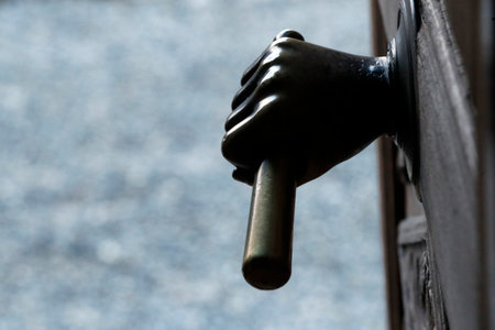 Saint Andrew church. Door handle. Domancy. France.のeditorial素材