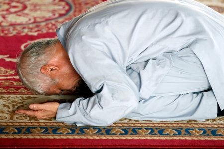 Minh Dang Quang buddhist temple. Man praying at buddhist ceremony. Ho Chi Minh city. Vietnam.のeditorial素材